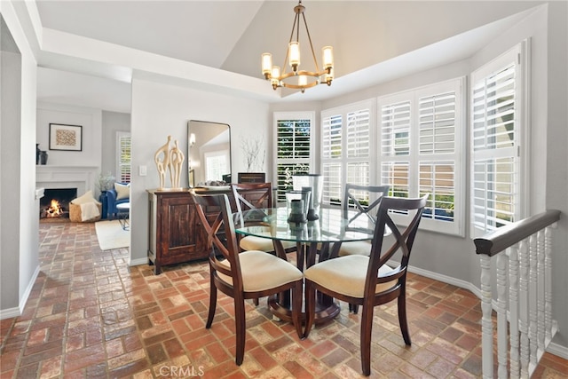 3 Treethorne Cir, Laguna Niguel, CA 92677 - dining room with a healthy amount of sunlight, baseboards, brick floor, and a chandelier