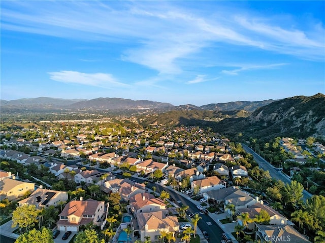 drone / aerial view featuring a residential view and a mountain view