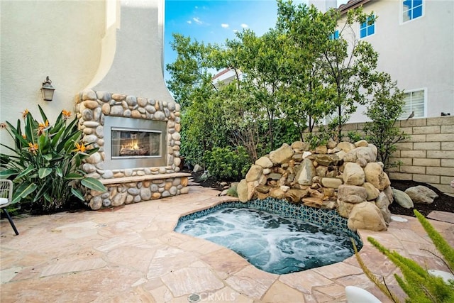 26238 Beecher Ln, Stevenson Ranch, CA 91381 - view of swimming pool featuring an outdoor stone fireplace, an in-ground hot tub, and a patio