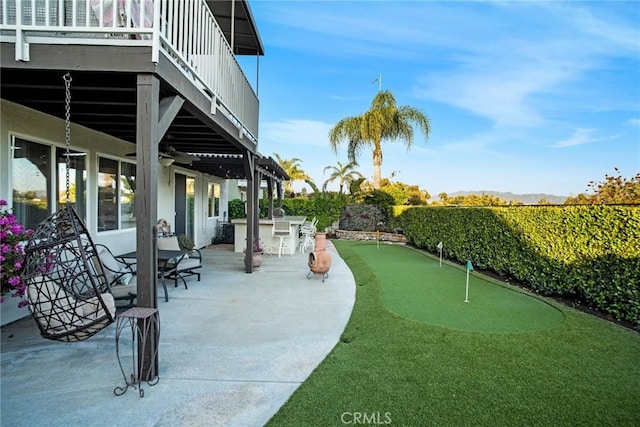 exterior space with outdoor dry bar and a patio