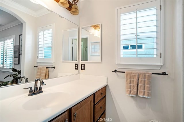 bathroom with vanity and ornamental molding