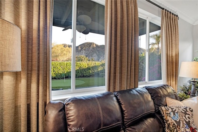 interior space with crown molding and a mountain view