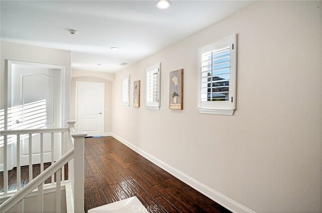 26238 Beecher Ln, Stevenson Ranch, CA 91381 - hall with plenty of natural light, dark wood-style floors, and recessed lighting