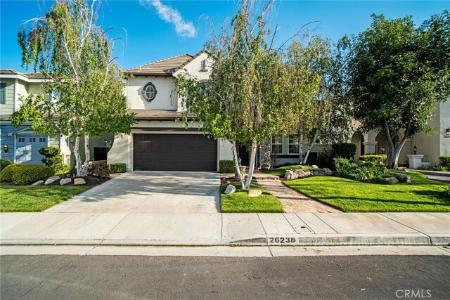 26238 Beecher Ln, Stevenson Ranch, CA 91381 - view of property hidden behind natural elements featuring stucco siding, a garage, concrete driveway, a tiled roof, and a front yard