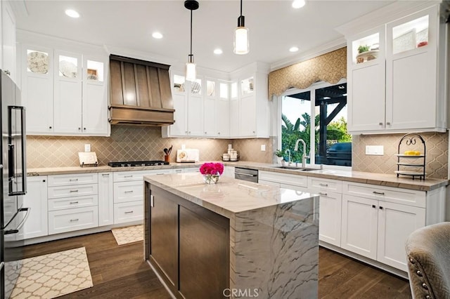 kitchen with custom exhaust hood, white cabinets, a sink, dark wood finished floors, and appliances with stainless steel finishes