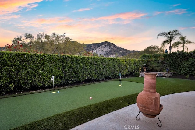 view of home's community featuring a mountain view and a fenced backyard
