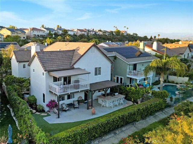 26238 Beecher Ln, Stevenson Ranch, CA 91381 - back of house with a balcony, a residential view, and a patio