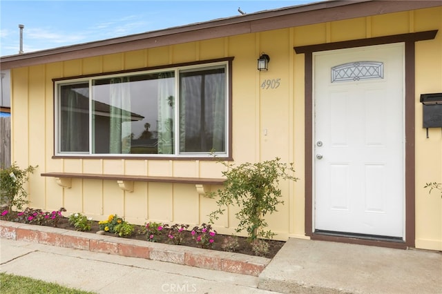 doorway to property with board and batten siding