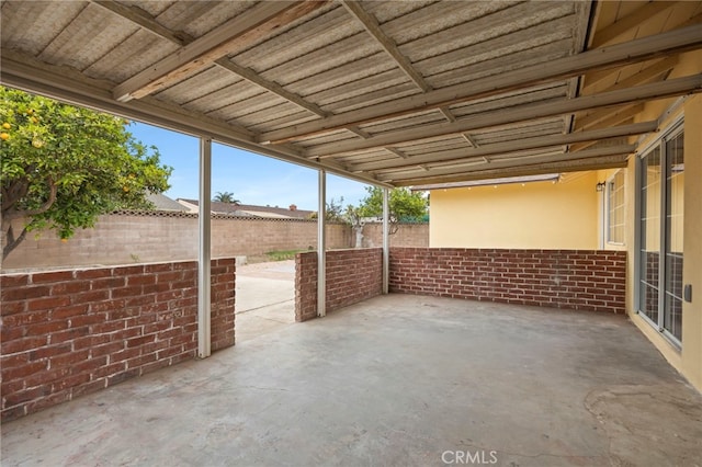 view of patio featuring fence