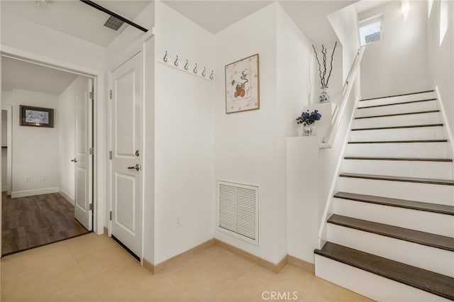 1210 Southwood Dr, San Luis Obispo, CA 93401 - stairway featuring visible vents, baseboards, and tile patterned flooring