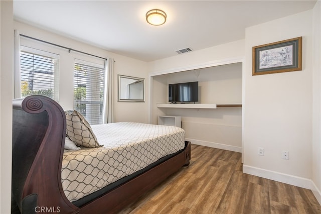 1210 Southwood Dr, San Luis Obispo, CA 93401 - bedroom with baseboards, wood finished floors, and visible vents