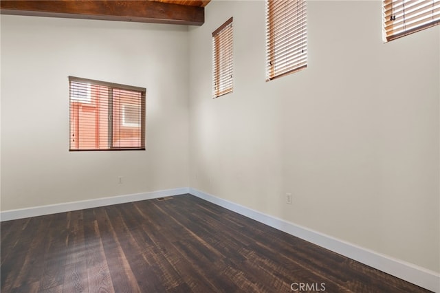 1210 Southwood Dr, San Luis Obispo, CA 93401 - empty room with baseboards, dark wood finished floors, and beamed ceiling