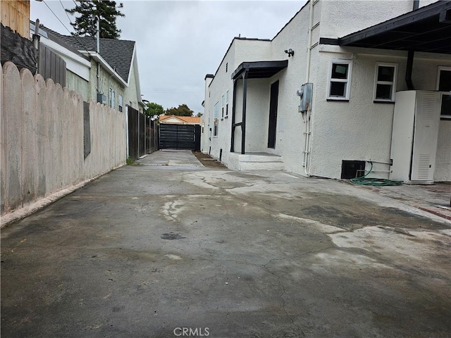 3612 Liberty Blvd, South Gate, CA 90280 - view of home's exterior with a patio, stucco siding, and driveway