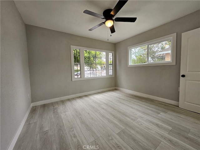 3612 Liberty Blvd, South Gate, CA 90280 - unfurnished room with wood finished floors, a ceiling fan, and baseboards