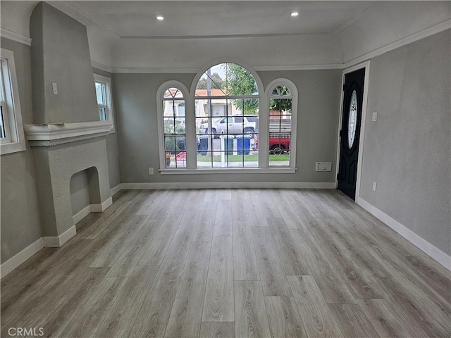3612 Liberty Blvd, South Gate, CA 90280 - unfurnished living room featuring wood finished floors, baseboards, crown molding, and recessed lighting