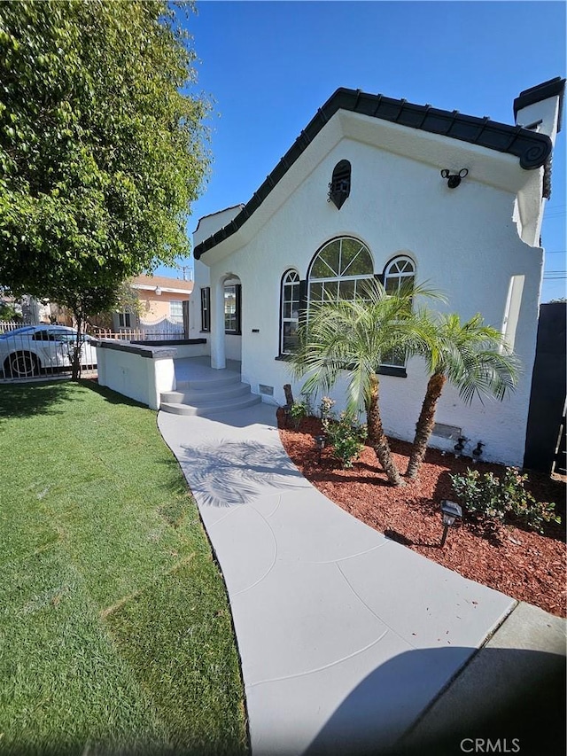3612 Liberty Blvd, South Gate, CA 90280 - view of front of home with a front yard and stucco siding