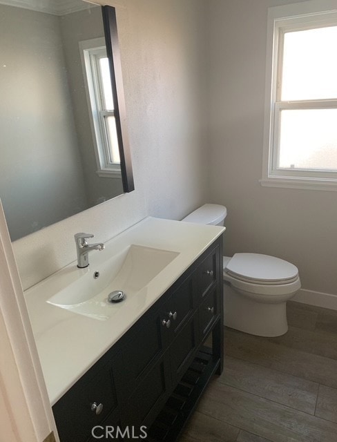 1613 Kane Ave, Simi Valley, CA 93065 - half bathroom featuring vanity, wood finished floors, and healthy amount of natural light