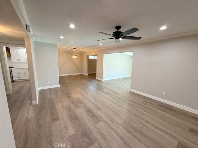 1613 Kane Ave, Simi Valley, CA 93065 - unfurnished living room with crown molding, recessed lighting, a ceiling fan, and light wood-style floors