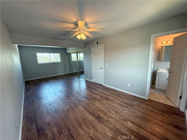 1613 Kane Ave, Simi Valley, CA 93065 - unfurnished bedroom with dark wood-style flooring, ceiling fan, and ensuite bathroom