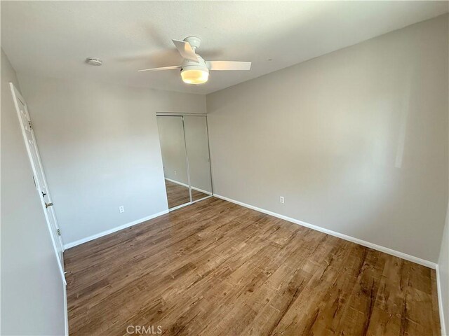 1613 Kane Ave, Simi Valley, CA 93065 - unfurnished bedroom with wood finished floors, a closet, and a ceiling fan