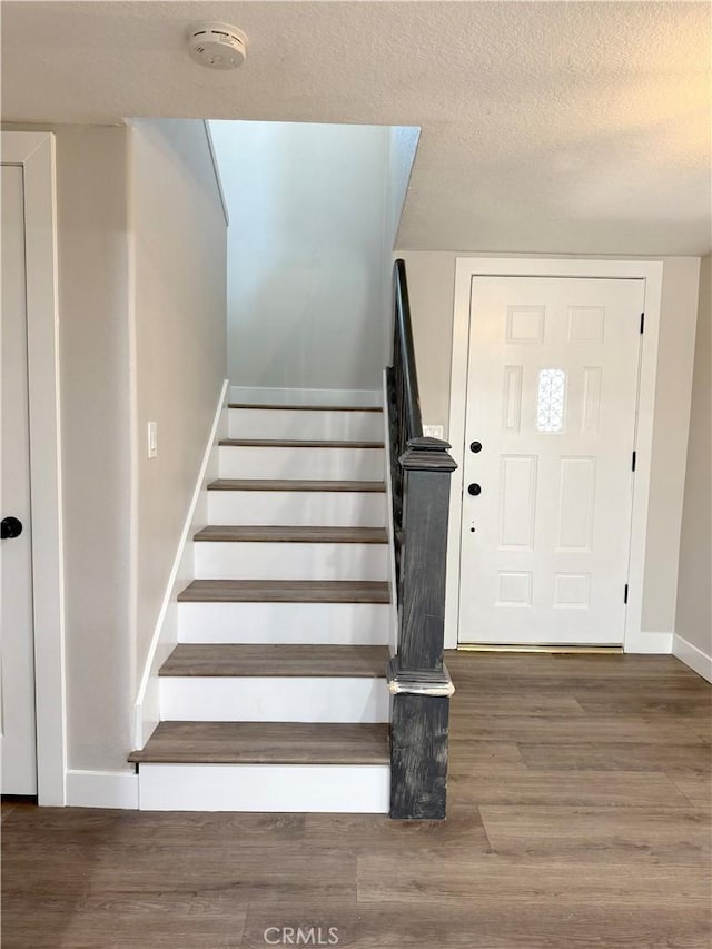 1613 Kane Ave, Simi Valley, CA 93065 - staircase featuring wood finished floors and a textured ceiling