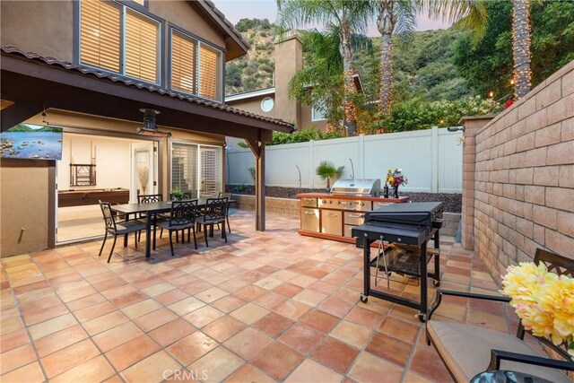 1720 San Alvarado Cir, Corona, CA 92882 - view of patio / terrace with area for grilling, outdoor dining area, and a fenced backyard