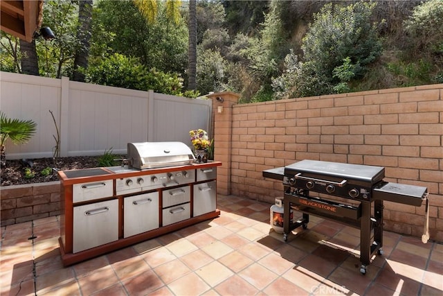 1720 San Alvarado Cir, Corona, CA 92882 - view of patio featuring exterior kitchen, fence, and area for grilling
