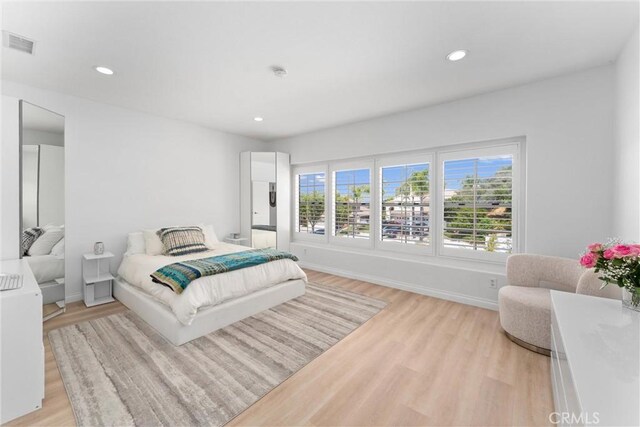 1720 San Alvarado Cir, Corona, CA 92882 - bedroom featuring light wood-style flooring, recessed lighting, and baseboards