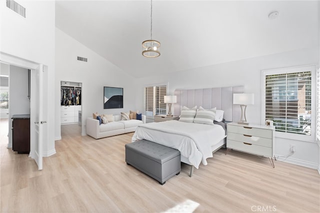 1720 San Alvarado Cir, Corona, CA 92882 - bedroom featuring light wood-style floors, high vaulted ceiling, baseboards, and a chandelier