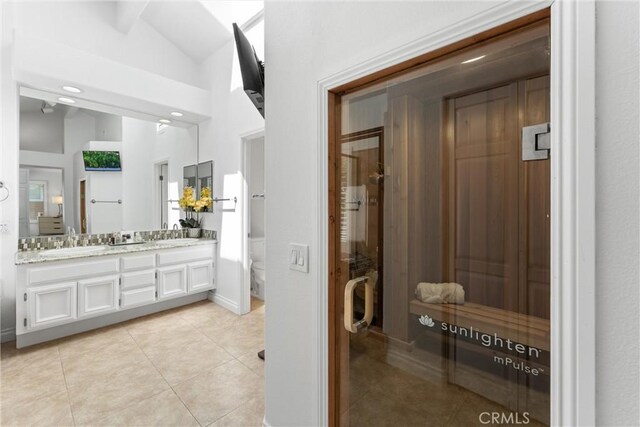 1720 San Alvarado Cir, Corona, CA 92882 - full bathroom featuring lofted ceiling, tile patterned floors, a sauna / steam room, toilet, and double vanity