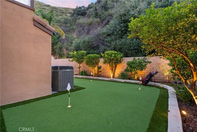 1720 San Alvarado Cir, Corona, CA 92882 - fenced backyard featuring central AC and a putting area