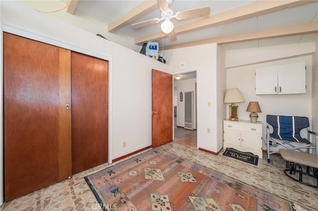 6828 Frontage Rd, Lucerne, CA 95458 - bedroom with a ceiling fan, wood finished floors, baseboards, lofted ceiling with beams, and a closet