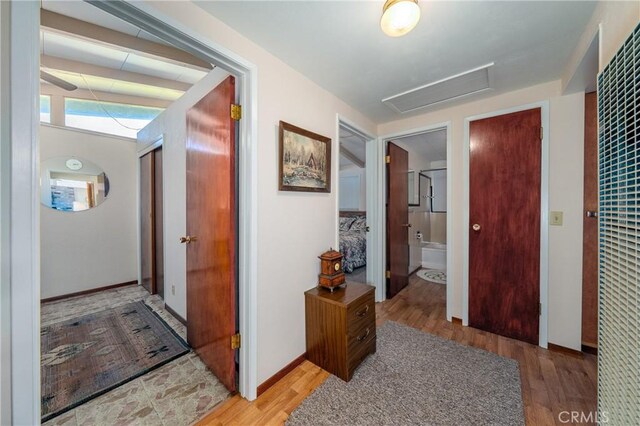 6828 Frontage Rd, Lucerne, CA 95458 - hall with attic access, a heating unit, and light wood finished floors