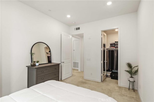 bedroom featuring light carpet, recessed lighting, and visible vents