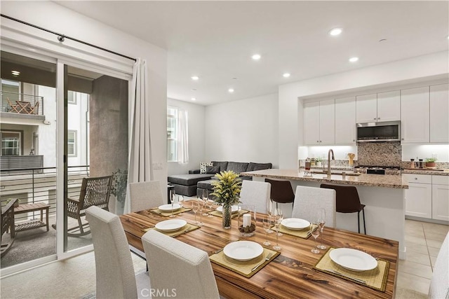 dining area featuring recessed lighting