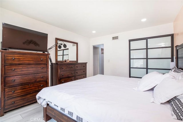 bedroom featuring recessed lighting and visible vents