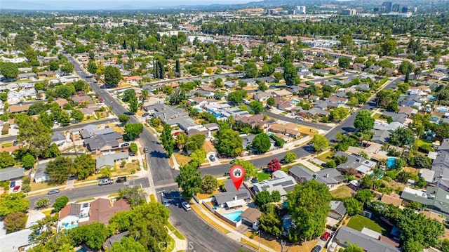 birds eye view of property with a residential view