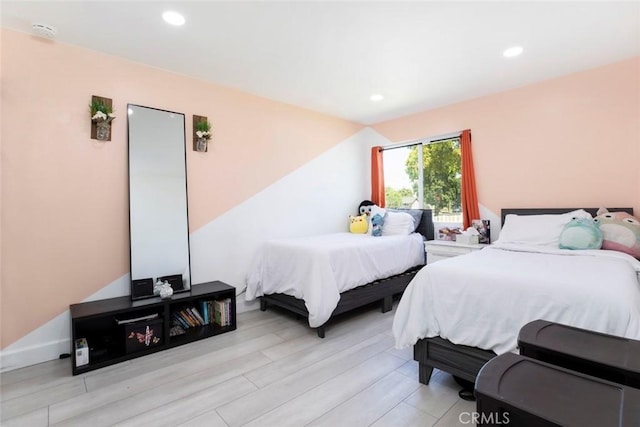 bedroom with recessed lighting and light wood finished floors