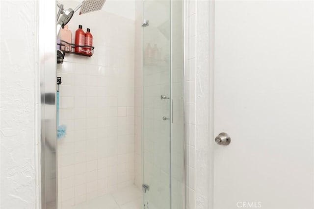 bathroom with a shower stall