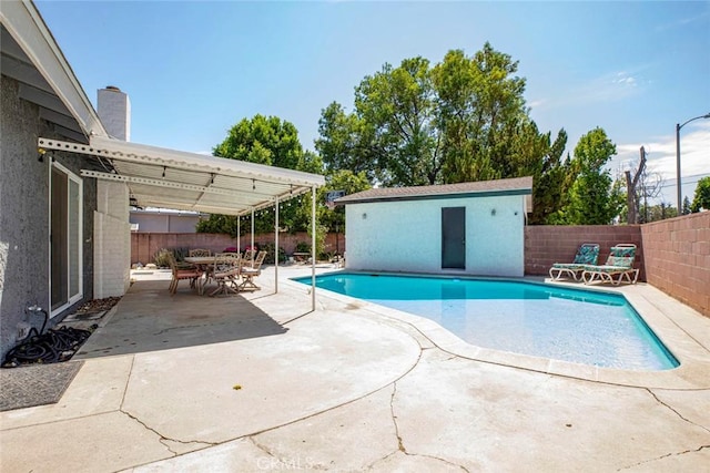 view of swimming pool with a patio, a fenced in pool, and a fenced backyard