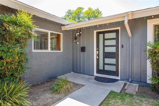 property entrance with board and batten siding