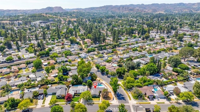 birds eye view of property with a residential view and a mountain view