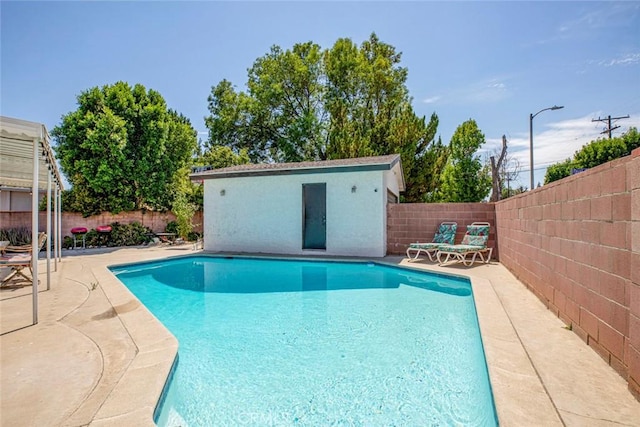 view of pool with a fenced in pool, a fenced backyard, and a patio area
