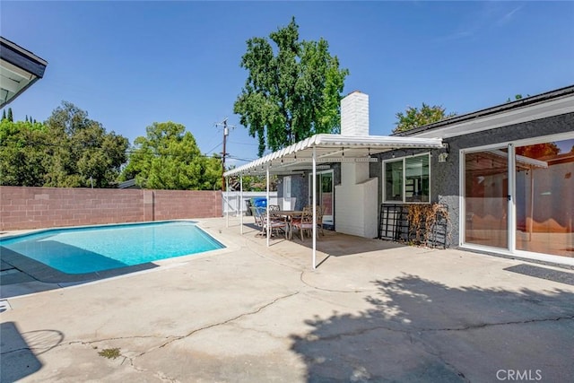 view of swimming pool featuring a fenced backyard, a fenced in pool, and a patio
