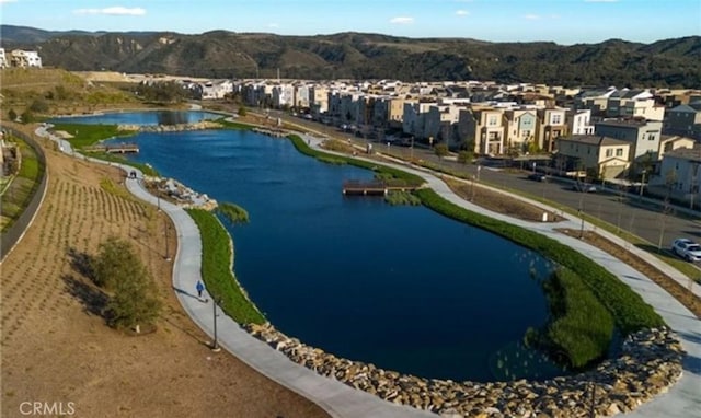 aerial view with a residential view and a water and mountain view