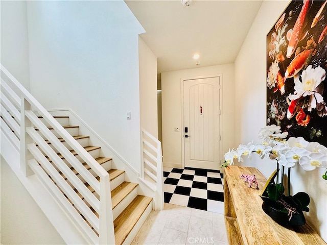 entrance foyer featuring stairs, recessed lighting, and tile patterned floors