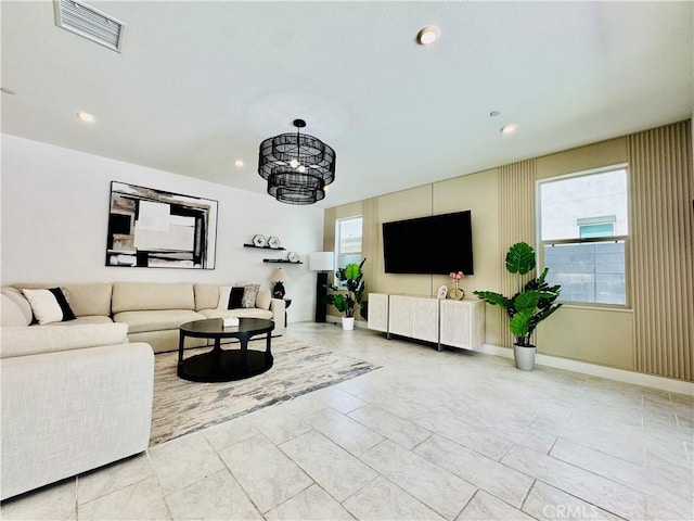living room with recessed lighting and visible vents