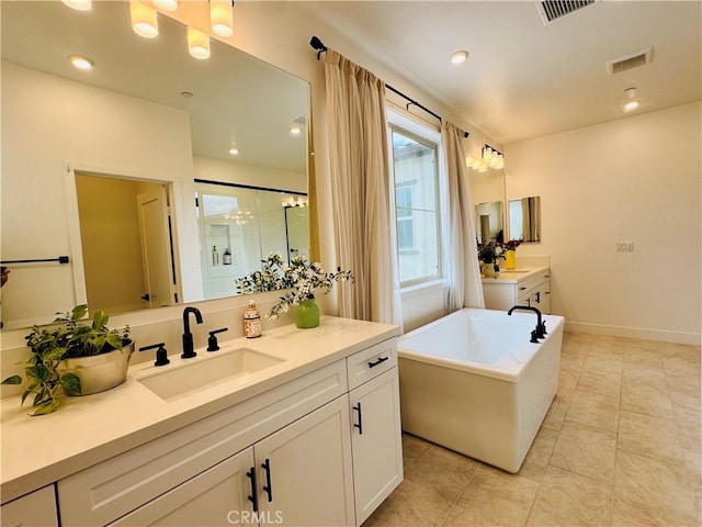 full bath featuring a sink, a soaking tub, a stall shower, and visible vents