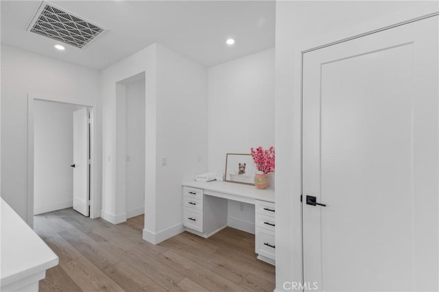 interior space featuring visible vents, recessed lighting, baseboards, and light wood-type flooring