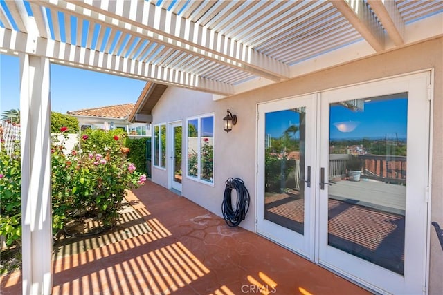 view of patio featuring french doors and a pergola